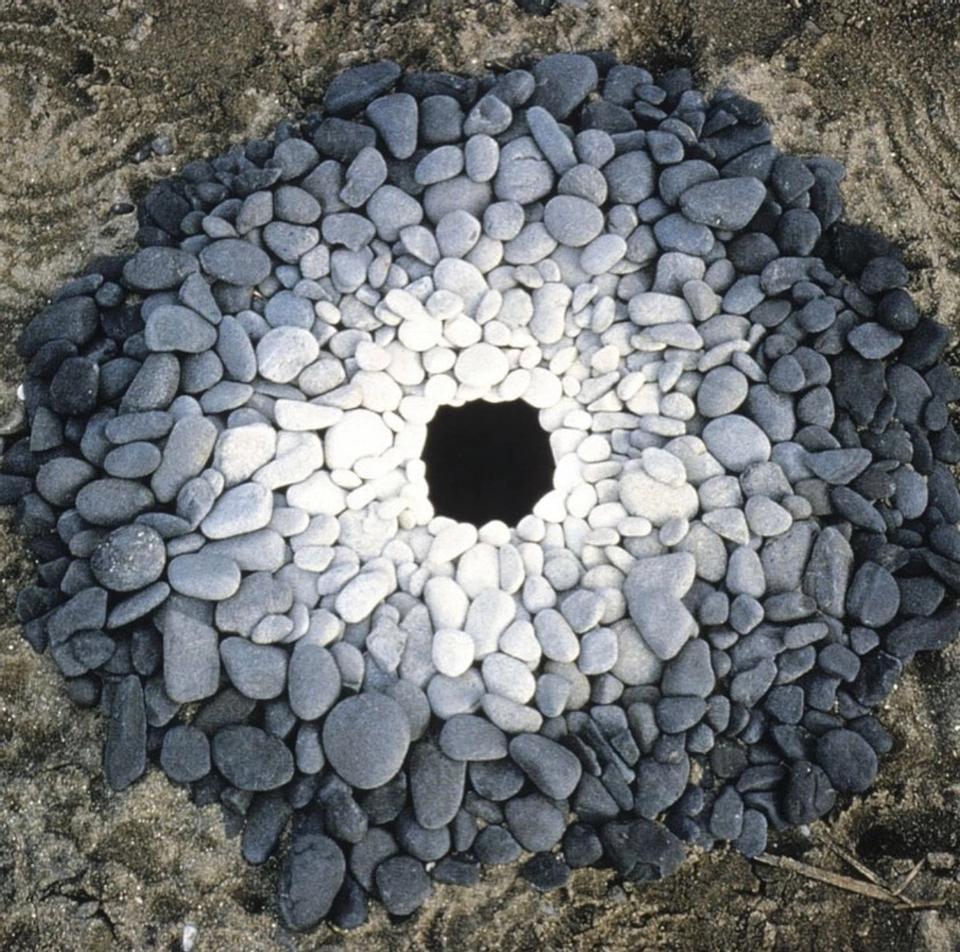 gray and white rocks art installation by Andy Goldsworthy