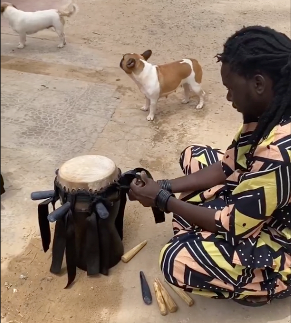 Aba working on a small sabar drum