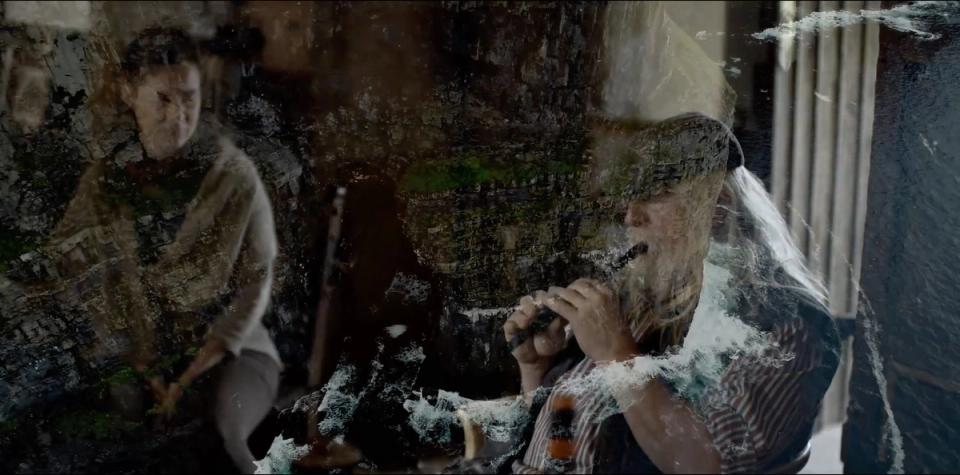 still shot from the short film merging images of Peia and flute player