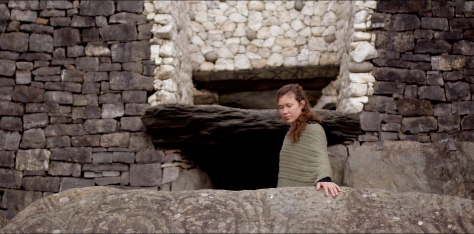 Peia touching ancient stone Peia touching ancient stone