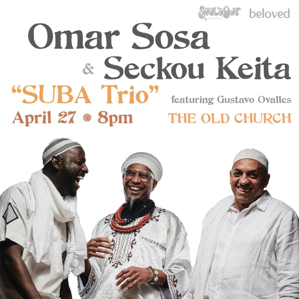 Omar Sosa, Seckou Keita, and Gustavo Ovalles all smiling and wearing white