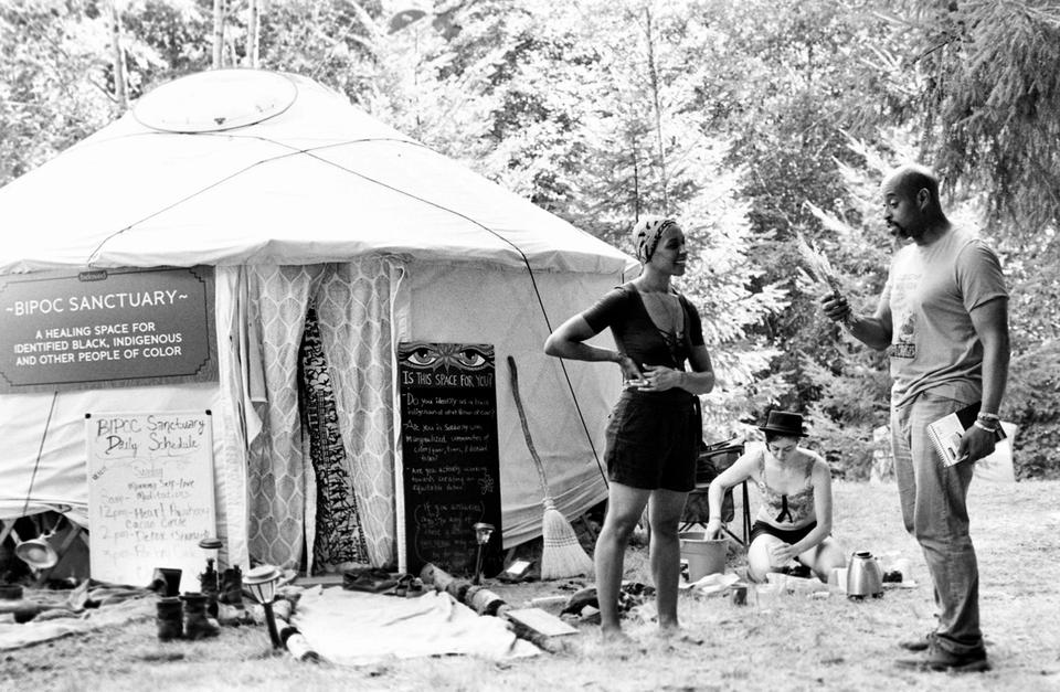 Two people standing by the BIPOC Sanctuary