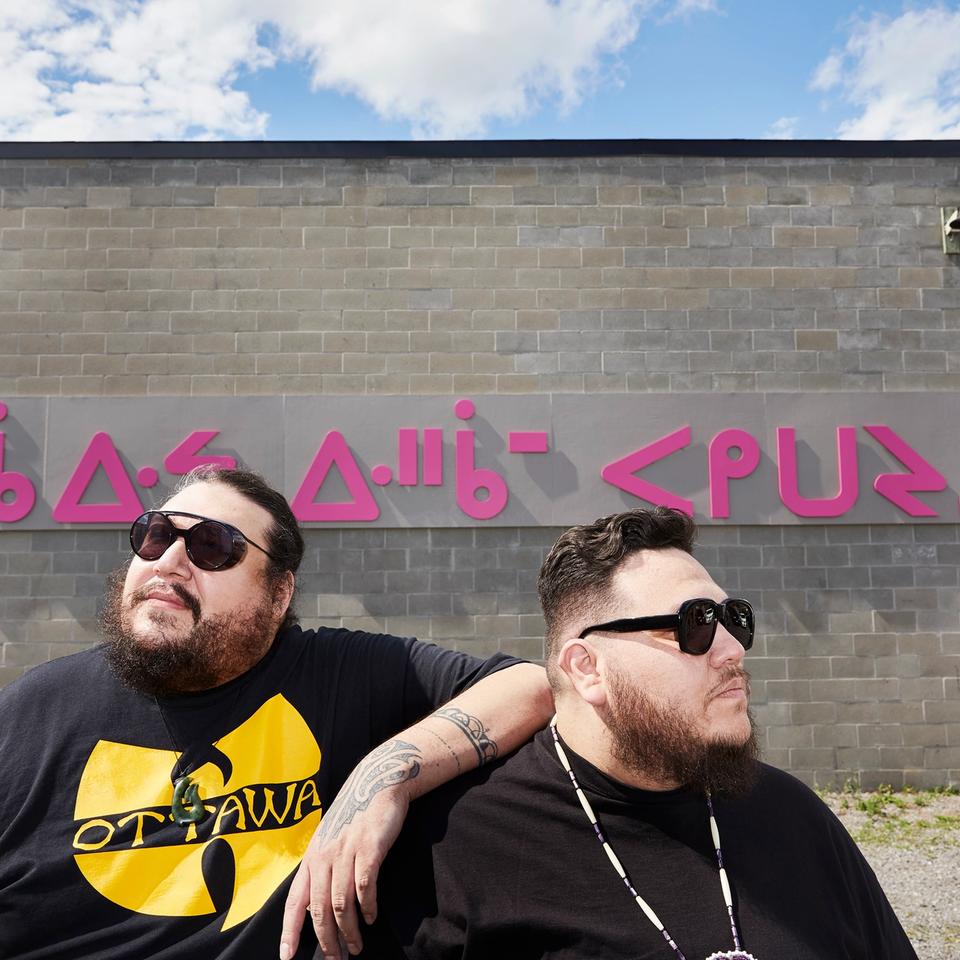 Halluci Nation duo in sunglasses