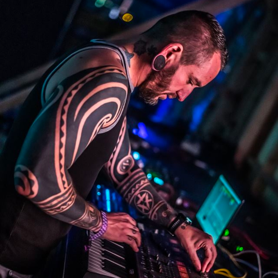 Bluetech in profile at the console Bluetech in profile at the console