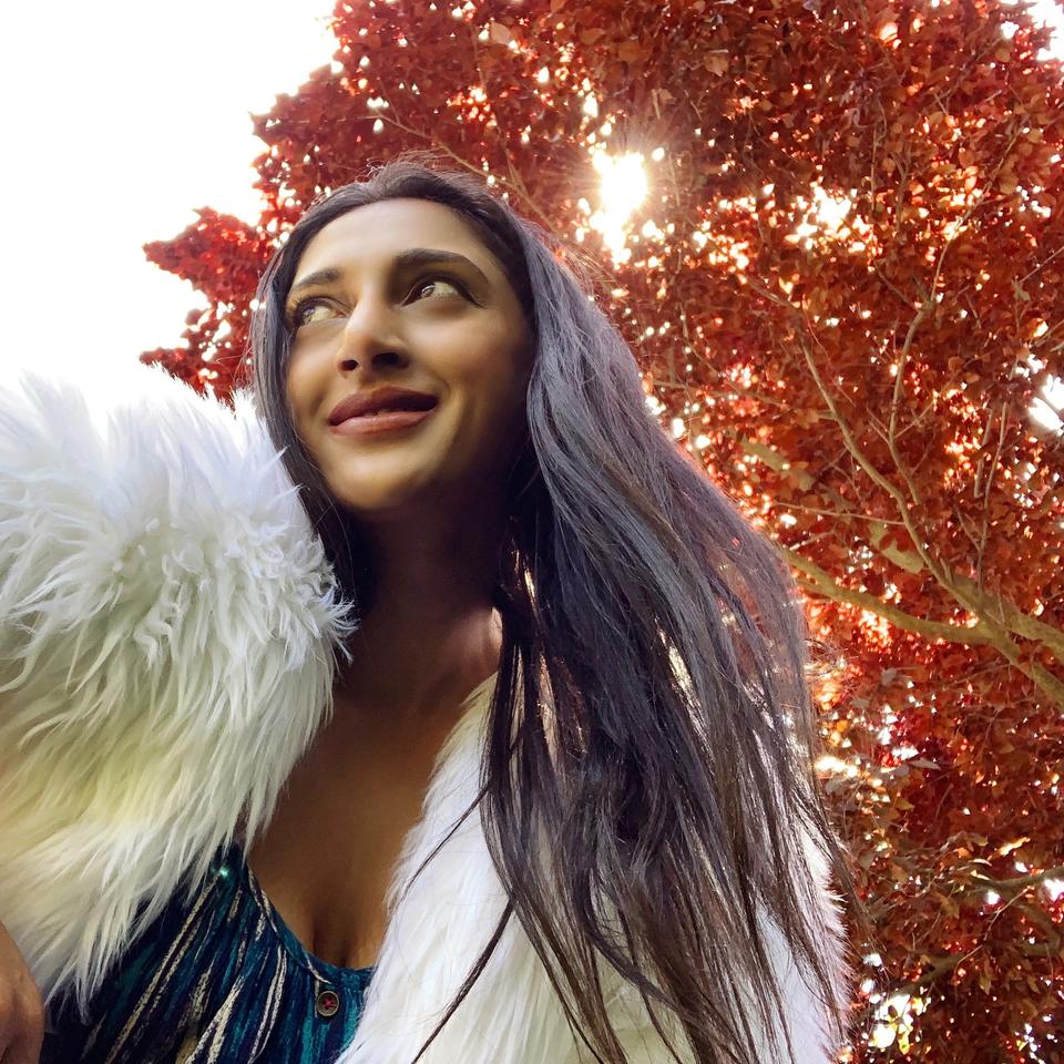 Aria in front of red leaf trees Aria in front of red leaf trees