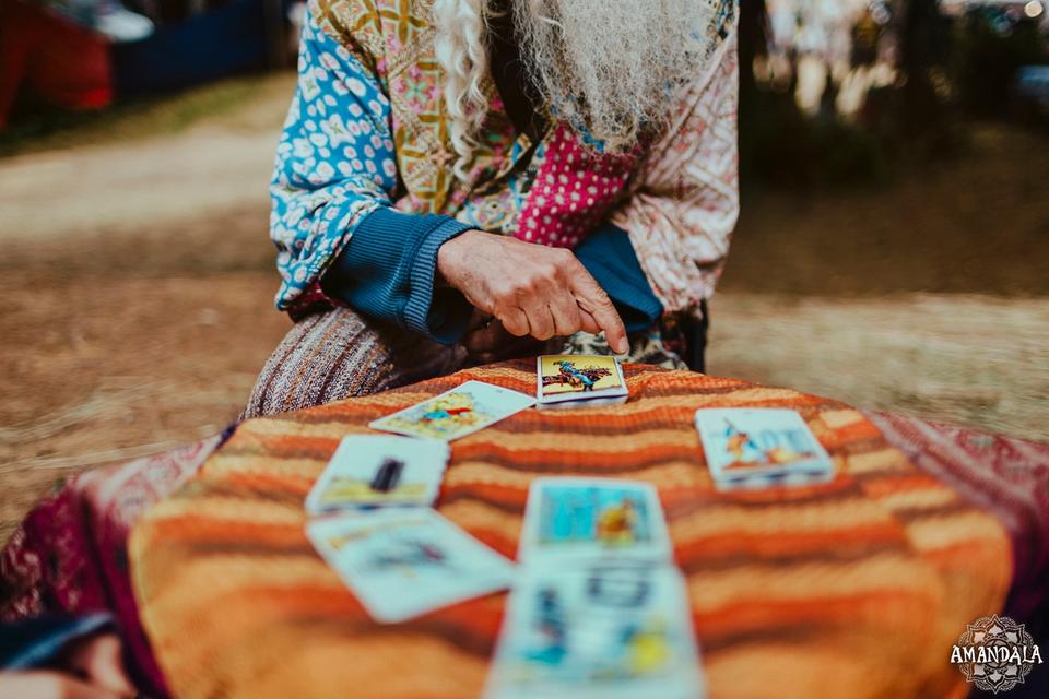 a tarot reader and their cards