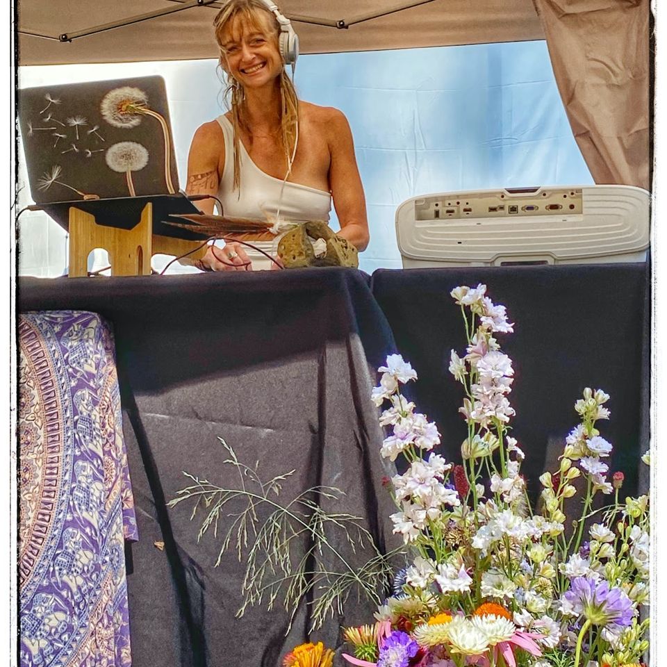 K. Maitri at the console smiling K. Maitri at the console smiling